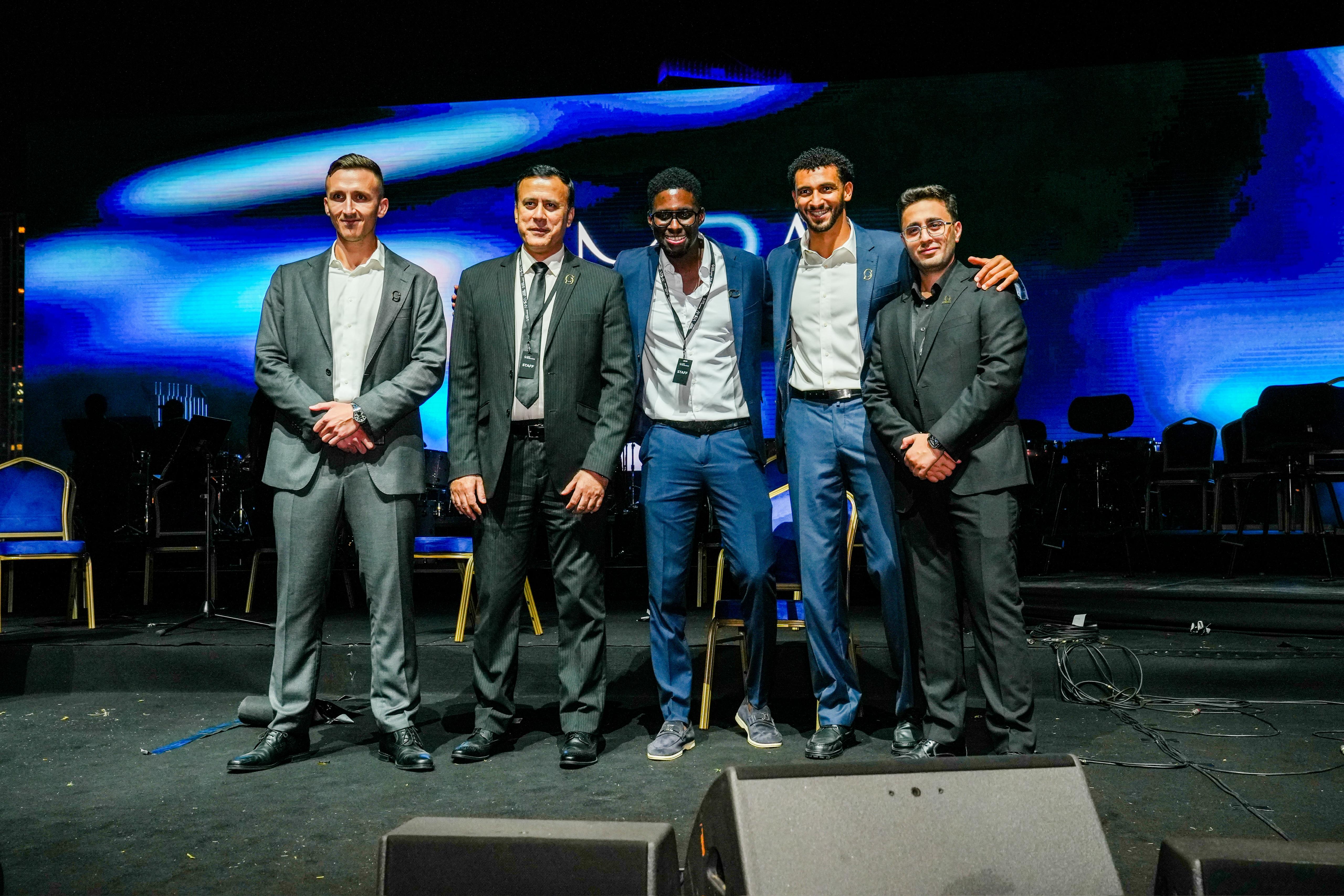 Daou Daly at a professional real estate event with partners
